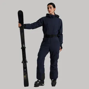 Navy blue one-piece ski suit for women with waterproof fabric and adjustable waist belt