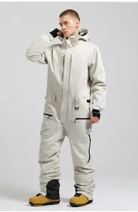Detail view of cream one-piece ski suit with windproof hood and multiple waterproof pockets