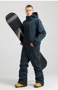 Detail of waterproof one-piece navy ski suit featuring a hood and functional zipper pockets