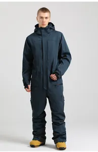 Detailed view of waterproof zippers and adjustable cuffs on a navy blue one-piece ski suit