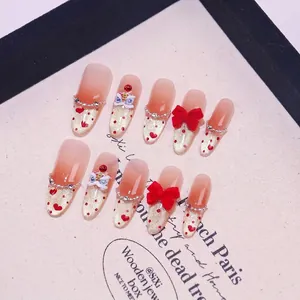 Handmade red press-on nails with 3D lion dance mascot and bow knots decoration
