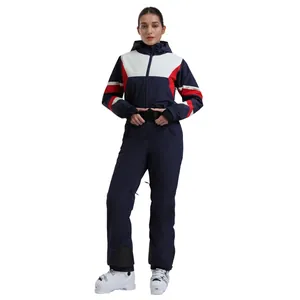 Women's navy blue one-piece ski suit with slim fit design and waterproof thermal fabric