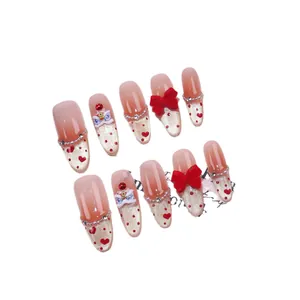 Handmade almond press-on nails with red lion dance decor and glitter hearts