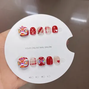 Handmade Chinese lion dance press-on nails set in red and cream for kids and women