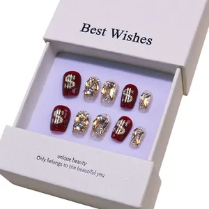 Handmade cherry red press-on nails with golden glitter and luxury rhinestone dollar charms