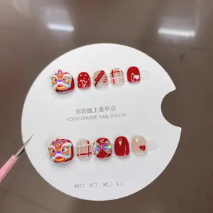 Handmade Chinese New Year press-on nails for kids with 3D lion dance and red glitter bow