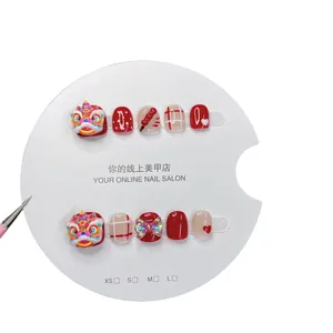 Handmade Chinese New Year press-on nails for kids with 3D lion dance and red festive designs