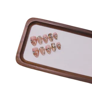 Luxurious French champagne glitter press-on nails with almond shape and golden cat eye effect