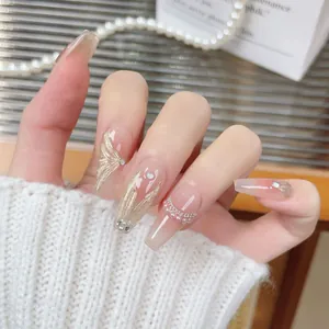 Elegant champagne gold mermaid tail press-on nails with pearls and glitter details