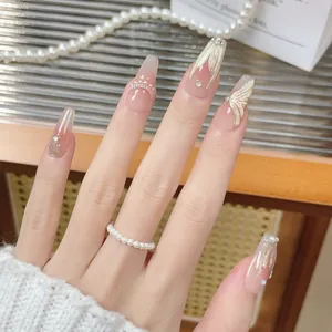 Handmade coffin press-on nails with golden mermaid tail patterns and pearl accents