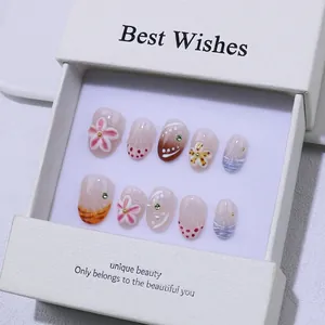 Handmade 3D floral press-on nails set with pink embossed flowers in a white gift box