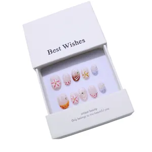 Handmade 3D floral press-on nails set with pink flowers and polka dots in a gift box