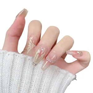 Handmade long ballerina press-on nails with champagne gold glitter and pearl accents