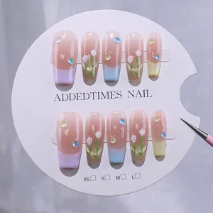 Handmade press-on nails with pastel macaron gradients and hand-painted tulip floral art