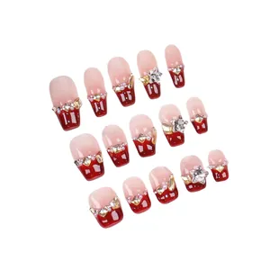 Handmade cherry red French gradient press-on nails with luxury rhinestones and pearls