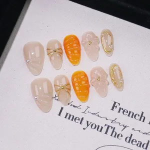 Handmade Press On Nails 3D Embossed Flower Almond Fake Nails With Artificial Pearl Bow Decoration Nude Orange Artificial Nails For Women