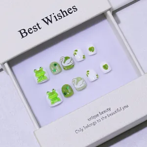 Cute green and white 3D cartoon press-on nails for kids with frog and swan designs in gift box