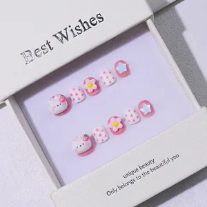 Handmade cute pink and white 3D press-on nails with cartoon rabbit and strawberry