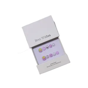 Handmade purple cartoon press-on nails with 3D hearts and glitter in a gift box