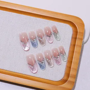 French gradient cat eye press-on nails with colorful rhinestones and glitter V-shape tips