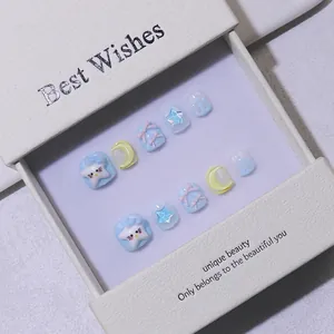 Handmade press-on nails for kids with 3D cartoon characters and blue stars in a gift box