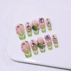 Pink and green gradient cat eye press-on nails with luxury rhinestones and bow details