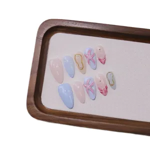 Handmade almond press-on nails with 3D sea stars, pearls, and blue ocean theme