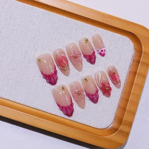 Handmade 3D floral almond press-on nails with pink purple gradient and gold bead accents