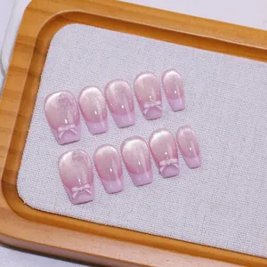 Pink cat eye handmade press-on nails with 3D bows and coffin shape gradient design