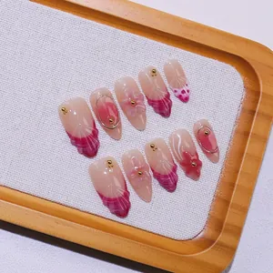 Handmade almond press-on nails with 3D floral relief and rose red gradient finish