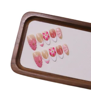 Handcrafted 3D floral almond press-on nails with pink gradient and gold beads
