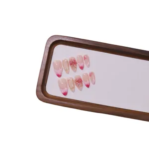 Pink French ombre handmade press-on nails with 3D floral art in medium almond shape