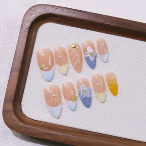 Handmade almond press-on nails with 3D floral petals and starfish ocean themed design