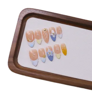 Handmade almond press-on nails with 3D floral carvings, pearls and French leopard pattern