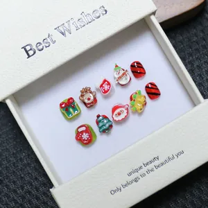 3D Christmas themed handmade press-on nail set with Santa and reindeer in a gift box