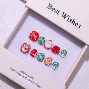 Faux ongles 3D faits main pour Noël avec motifs Père Noël, bonhomme de neige et Joy