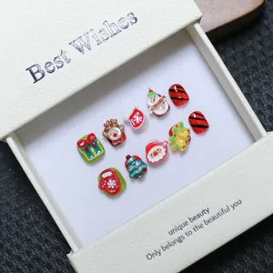 Handmade 3D Christmas press-on nails set featuring Santa, reindeer, and festive 3D resin art