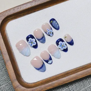 Blue and pink gradient press-on nails with 3D floral accents and gold beads in 10-piece set
