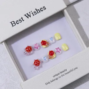 Handmade kids press-on nails with cute 3D turtle and star designs in a gift box