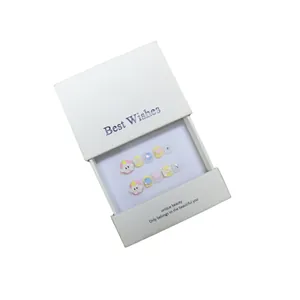 Handmade press-on nails for kids with cute 3D charms and pastel colors in a gift box