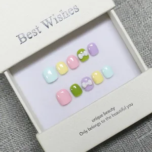 Handmade macaron colored children's press-on toenails with cute 3D bows in a premium gift box