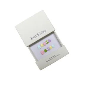 Handmade colorful press-on nails for kids in a premium white gift box with bow accents