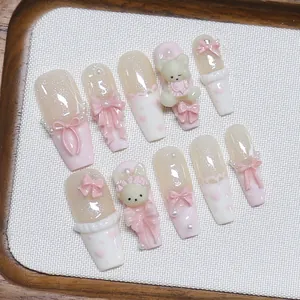 Handmade 3D press-on nails with cute pink bears, bows and pearls in coffin shape