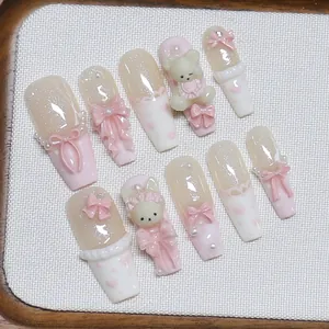Handmade pink and white press-on nails with 3D cute bears and pearls for women