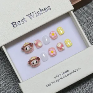 Handmade press-on nails for kids with cute cartoon monkey and resin flower designs