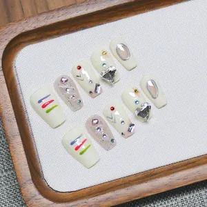 Handmade Y2K press-on nails set with heart rhinestones and colorful hand-painted designs