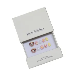 Handmade 3D cartoon press-on nails for kids featuring monkeys and flowers in a gift box