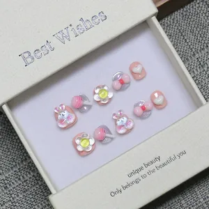 Faux ongles faits main pour enfants roses et blancs avec lapin et bonbons 3D