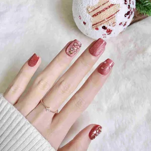Unghie finte cat eye oro rosa glitterate con perle e stelle decorative
