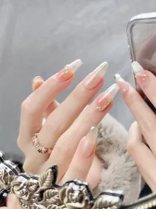 Macro detail of cat-eye gradient press-on nails with silver glitter and rhinestone accents